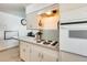 Cozy kitchen featuring a stainless steel oven, laminate countertops, and neutral backsplash at 856 N Evergreen St, Chandler, AZ 85225