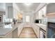 Functional kitchen with white cabinetry, sleek countertops, and modern appliances at 856 N Evergreen St, Chandler, AZ 85225