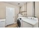 The laundry room is equipped with a washer, dryer, and a freezer at 856 N Evergreen St, Chandler, AZ 85225
