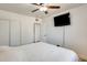 The main bedroom has a ceiling fan, closet, and wall-mounted television at 856 N Evergreen St, Chandler, AZ 85225