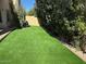 Backyard featuring pristine synthetic grass and desert landscaping at 9070 E Gary Rd # 152, Scottsdale, AZ 85260
