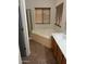 Bathroom featuring a large soaking tub, sink, wooden cabinets, and a standup shower at 9070 E Gary Rd # 152, Scottsdale, AZ 85260