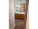 Bathroom with a sink, a wooden cabinet, a mirror, and tiled floors at 9070 E Gary Rd # 152, Scottsdale, AZ 85260