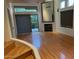Bright living room with wood floors, fireplace, and sliding glass doors at 9070 E Gary Rd # 152, Scottsdale, AZ 85260