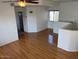 The living room has hardwood floors, white walls, and a window with natural light at 9070 E Gary Rd # 152, Scottsdale, AZ 85260