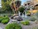 Scenic community water feature with boulders, water fountain and lush desert foliage at 9070 E Gary Rd # 152, Scottsdale, AZ 85260