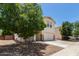 Charming two-story home with a well-maintained lawn and a spacious two car garage at 9133 W Virginia Ave, Phoenix, AZ 85037