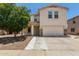 Charming two-story home with a well-maintained lawn and a spacious two car garage at 9133 W Virginia Ave, Phoenix, AZ 85037