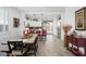 Elegant dining area with an open view to the kitchen and back patio at 9238 W Roma Ave, Phoenix, AZ 85037
