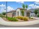 Well-maintained home exterior with lush landscaping and appealing curb appeal in a corner lot at 9238 W Roma Ave, Phoenix, AZ 85037