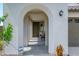 Charming front entry with arched walkway and Ring security system for enhanced safety at 9238 W Roma Ave, Phoenix, AZ 85037