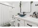 Stylish bathroom with a sleek vanity, vessel sink, modern fixtures, and a shower-tub combo at 9471 W Magnum Dr, Arizona City, AZ 85123