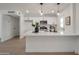 Modern kitchen featuring white cabinetry, stainless steel appliances, and a spacious quartz countertop island at 1051 E Millett Ave, Mesa, AZ 85204