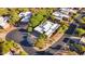 Aerial view of a spacious home surrounded by mature trees in a quiet neighborhood at 11299 E Greythorn Dr, Scottsdale, AZ 85262
