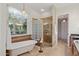 Charming bathroom features a freestanding tub and a glass-enclosed shower at 11299 E Greythorn Dr, Scottsdale, AZ 85262