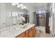 Bright bathroom with double sinks and stylish vanity lighting at 11299 E Greythorn Dr, Scottsdale, AZ 85262