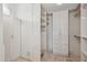 Bright walk-in closet featuring custom shelving and ample storage at 11299 E Greythorn Dr, Scottsdale, AZ 85262