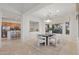 Dining room with a view of the kitchen, modern decor, and plenty of natural light at 11299 E Greythorn Dr, Scottsdale, AZ 85262