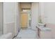 Entryway featuring a light wood door, tiled accents, and a 'Welcome' mat at 11299 E Greythorn Dr, Scottsdale, AZ 85262