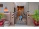 Charming front gate with decorative details and custom address plaque, showcasing the home's unique character at 11299 E Greythorn Dr, Scottsdale, AZ 85262