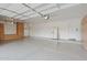 Spacious three car garage featuring built-in cabinets and storage at 11299 E Greythorn Dr, Scottsdale, AZ 85262