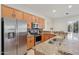 Modern kitchen featuring stainless steel appliances, granite countertops, and ample cabinet space at 11299 E Greythorn Dr, Scottsdale, AZ 85262