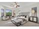 Spacious main bedroom with neutral tones, a ceiling fan, and plenty of natural light at 11299 E Greythorn Dr, Scottsdale, AZ 85262