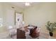 Spacious home office featuring a ceiling fan and natural light at 11299 E Greythorn Dr, Scottsdale, AZ 85262