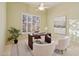 Inviting home office with plantation shutters, and a ceiling fan at 11299 E Greythorn Dr, Scottsdale, AZ 85262