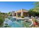 Relaxing pool area with lush greenery, access to outdoor living space, and view of the home's exterior at 11299 E Greythorn Dr, Scottsdale, AZ 85262