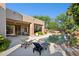 Beautiful pool area featuring lounge chairs, desert landscaping, and easy access to the home's covered patio at 11299 E Greythorn Dr, Scottsdale, AZ 85262