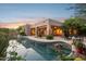 Stunning backyard pool area with a covered patio and lounge chairs for relaxation at 11299 E Greythorn Dr, Scottsdale, AZ 85262