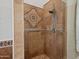 Modern tiled shower featuring mosaic accent and grab bar at 11299 E Greythorn Dr, Scottsdale, AZ 85262