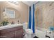 Bathroom featuring a modern vanity, a toilet, and a shower with stylish tiling, offering a functional and aesthetically pleasing design at 11383 W Pima St, Avondale, AZ 85323