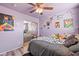 This bedroom includes a full-length mirror and a playful arrangement of plush toys, creating a cheerful and inviting space at 11383 W Pima St, Avondale, AZ 85323