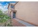 Inviting front entrance with security door, sidelight window and flowering plants at 11383 W Pima St, Avondale, AZ 85323