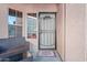 Inviting front porch with a security door, window, and a cozy seating area at 11383 W Pima St, Avondale, AZ 85323