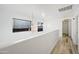Hallway with chandelier and wood-look floors at 11383 W Pima St, Avondale, AZ 85323