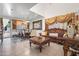 Open-concept living space with dining area and staircase, showcasing high ceilings and stylish decor at 11383 W Pima St, Avondale, AZ 85323