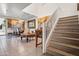 Open-concept living space with dining area, showcasing high ceilings and staircase at 11383 W Pima St, Avondale, AZ 85323