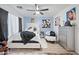 Bright primary bedroom with a large bed, dresser, and stylish decorations at 11383 W Pima St, Avondale, AZ 85323