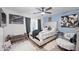 Comfortable primary bedroom with a large bed, modern decor, and ceiling fan at 11383 W Pima St, Avondale, AZ 85323