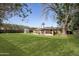 Expansive backyard with lush green lawn and a charming gazebo, perfect for outdoor gatherings at 1158 N Barkley St, Mesa, AZ 85203