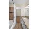 Bathroom showcasing a tub-shower, granite vanity, and connection to the bedroom at 1158 N Barkley St, Mesa, AZ 85203