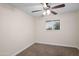 Carpeted bedroom with a ceiling fan and a window allowing for natural light at 1158 N Barkley St, Mesa, AZ 85203