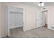 Spacious bedroom with wood-look tile flooring, a closet, and an open doorway at 1158 N Barkley St, Mesa, AZ 85203