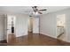 Bedroom view showcasing wood-look floors, multiple doorways, and a closet with organizers at 1158 N Barkley St, Mesa, AZ 85203