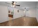 Spacious living room with wood floors, ceiling fans and ample lighting at 1158 N Barkley St, Mesa, AZ 85203