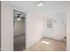 Bright mud room with beige tile floor and white trim throughout, leading to bedroom with ceiling fan at 1158 N Barkley St, Mesa, AZ 85203