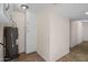 Enclosed utility area featuring tile flooring, cabinetry, and a modern water heater at 1158 N Barkley St, Mesa, AZ 85203